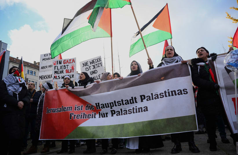  People hold a banner reading "Jerusalem is the capital of Palestine Freedom for Palestine" as they take part in a demonstration in solidarity with Palestinians in Gaza, amid the ongoing conflict between Israel and the Palestinian group Hamas, in Berlin, Germany November 18, 2023. (photo credit: REUTERS)