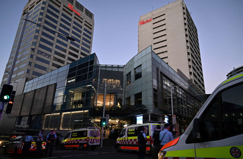  Emergency service workers stand near Bondi Junction after multiple people were stabbed inside the Westfield Bondi Junction shopping centre in Sydney, April 13, 2024. (photo credit: AAP Image/Steven Saphore via REUTERS)