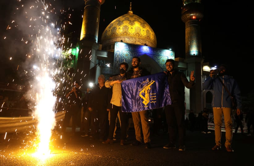  Iranians celebrate on a street, after the IRGC attack on Israel, in Tehran, Iran, April 14, 2024. (photo credit: VIA REUTERS)
