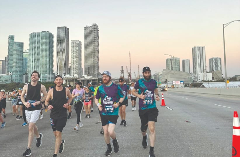  Team Mordy in action at the Miami Marathon. (photo credit: @picturesperfectphotoss)