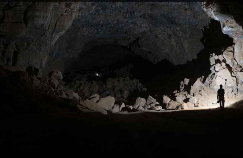   Researchers exploring the Umm Jirsan Lava Tube system. (photo credit: CREATIVE COMMONS)