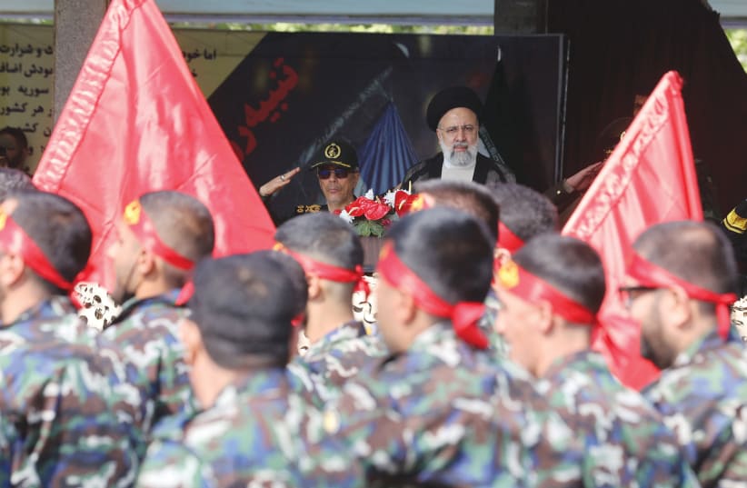  IRANIAN PRESIDENT Ebrahim Raisi looks at the armed forces members during the National Army Day parade ceremony in Tehran, on April 17. (photo credit: MAJID ASGARIPOUR/WANA/REUTERS)