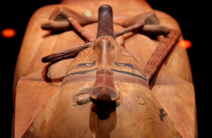 The coffin of Ramses II is seen during the press visit of the exhibition "Ramses the Great & the Gold of the Pharaohs" at the Grande Halle de la Villette in Paris, France, April 6, 2023.  (photo credit: STEPHANIE LECOCQ/REUTERS)