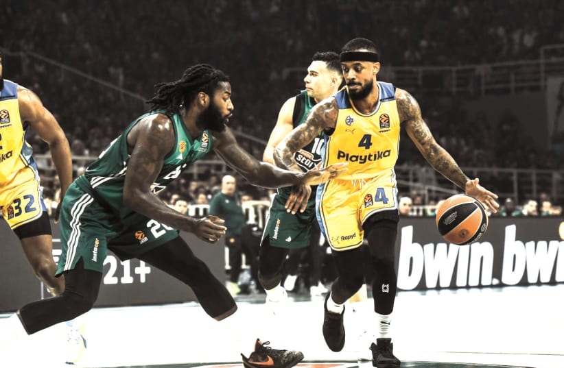  MACCABI TEL AVIV’S Lorenzo Brown (right) dribbles against Panathinaikos defender Mathias Lessort during the yellow-and-blue’s 91-87 victory. (24/4/2024) (photo credit: TOURRETTE PHOTOGRAPHY/ANDREAS PAPAKONSTANTINOU)