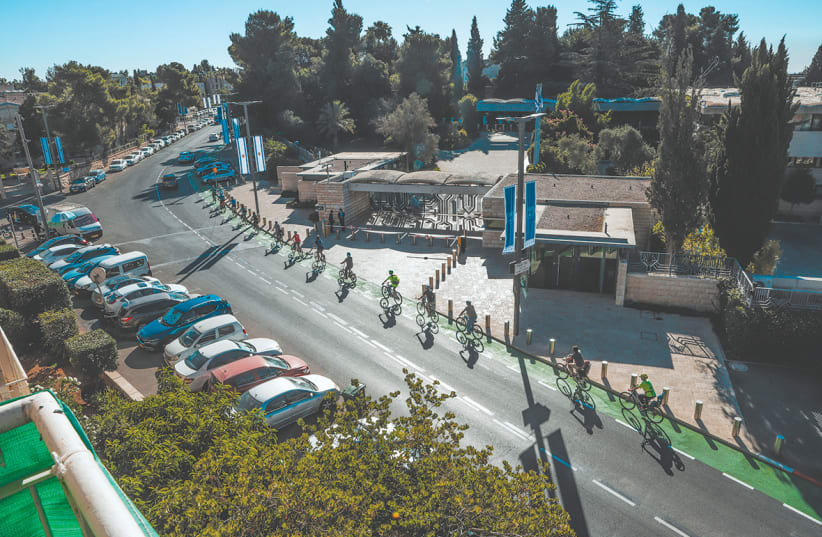  Cyclists are seen on the bicycle path on Hanassi Street in Jerusalem. (photo credit: Shlomit Wolf)