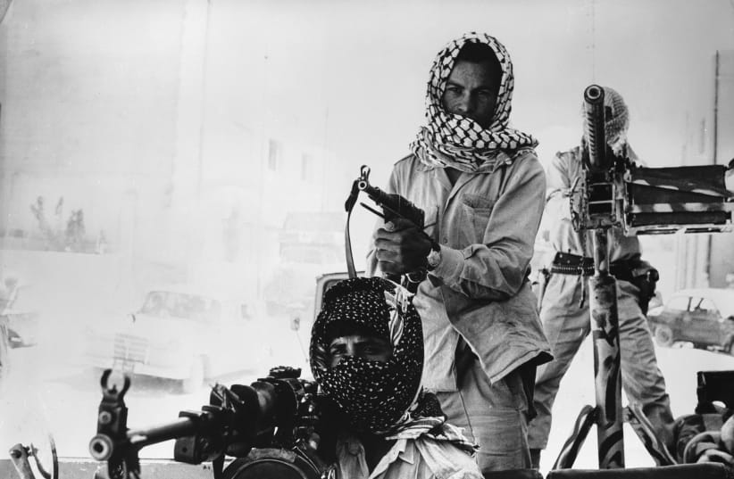  PALESTINIAN GUERRILLAS patrol the Amman streets in Sept. 1970, after a civil war – known as Black September – broke out between the Jordanian army and various Palestinian forces. (photo credit: Central Press/Getty Images)