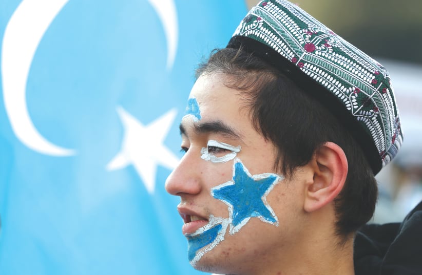  A man from China's Uyghur Muslim ethnic group. A recent interfaith panel took place in New York looking at the human rights violations against the Uyghurs by the Chinese government. (photo credit: MURAD SEZER/REUTERS)
