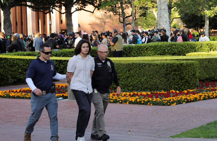  LAPD detain students from a protest encampment in support of Palestinians at the University of Southern California’s Alumni Park, as the conflict between Israel and the Palestinian Islamist group Hamas continues, in Los Angeles, California, U.S., April 24, 2024. (photo credit: REUTERS/ZAYDEE SANCHEZ)