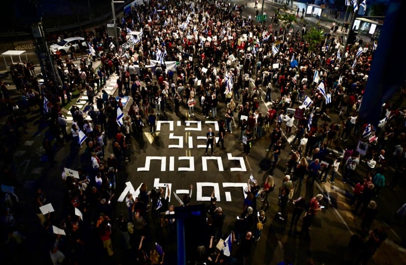  Protesters in Tel Aviv demonstrate against the government, with the message "Rafah can wait, they can't," referring to the hostages still in Gaza. (photo credit: AVSHALOM SASSONI/MAARIV)
