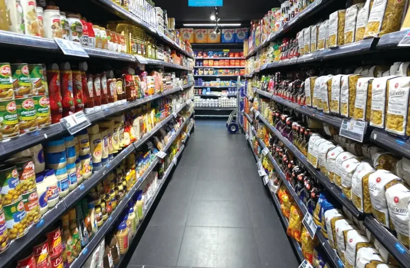  Shelves carts in a supermarket  (photo credit: Avshalom Shoshoni)