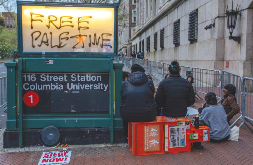  ‘FREE PALESTINE’ is displayed at a subway station entrance, outside of Columbia University in New York City, last week. Radicals, in many cases, have no concept of whether they are trying to liberate Palestine, Texas, or maybe East Palestine, Ohio, says the writer.  (photo credit: David ‘Dee’ Delgado/Reuters)