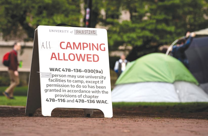  A SIGN modified by demonstrators to read ‘University of Palestine’ that allows ‘all’ camping at a protest encampment in support of Palestinians at the University of Washington in Seattle, this week.  (photo credit: David Ryder/Reuters)