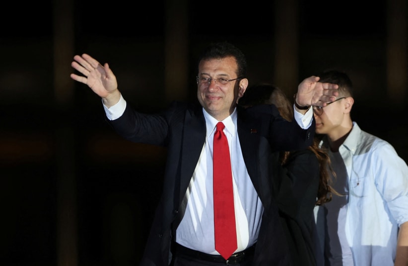  Istanbul Mayor Ekrem Imamoglu, mayoral candidate of the main opposition Republican People's Party (CHP), greets his supporters following the early results in front of the Istanbul Metropolitan Municipality (IBB) in Istanbul, Turkey April 1, 2024. (photo credit: REUTERS/UMIT BEKTAS)