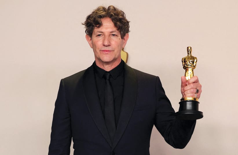  Film director Jonathan Glazer poses with his Oscar for Best International Feature Film at the 96th Academy Awards in Hollywood on March 10. (photo credit: Carlos Barria/Reuters)