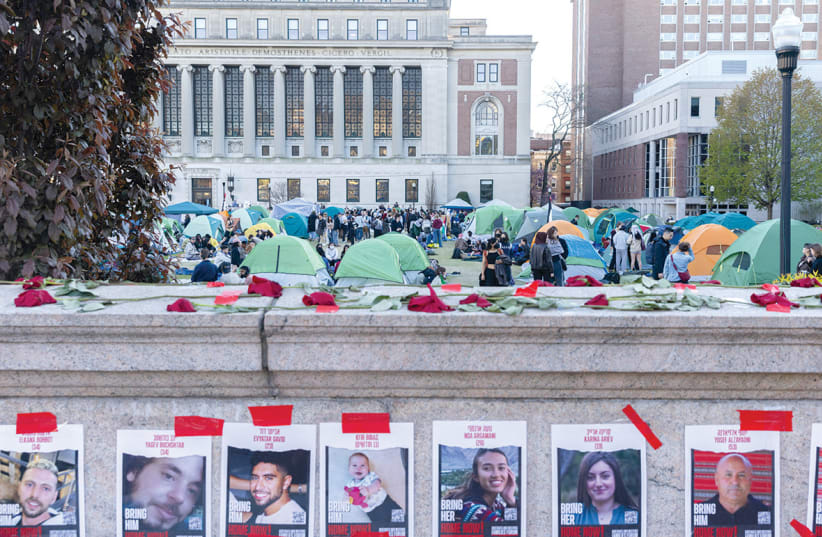 Pro-Palestinian protesters maintain an encampment on Columbia University campus on April 24, 2024.  (photo credit: JEENAH MOON/REUTERS)
