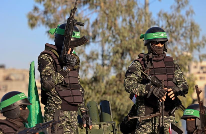  Hamas terrorists (photo credit: MOHAMMED ABED/AFP via Getty Images)