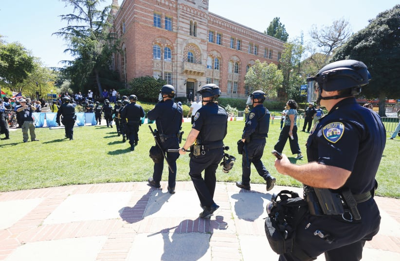  POLICE ARE called in at UCLA in Los Angeles, last week. The rhetoric in these demonstrations frequently flows over into pure antisemitism, while Jewish students and academic staff are often harassed and intimidated, the writer notes.  (photo credit: DAVID SWANSON/REUTERS)
