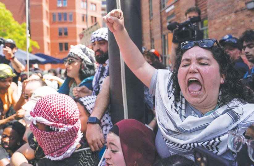  A PRO-PALESTINIAN protest takes place at University Yard on the campus of George Washington University, in Washington, DC, last week. Protesters shouted ‘Whose campus? Our campus!’ says the writer. (photo credit: Nathan Howard/Reuters)