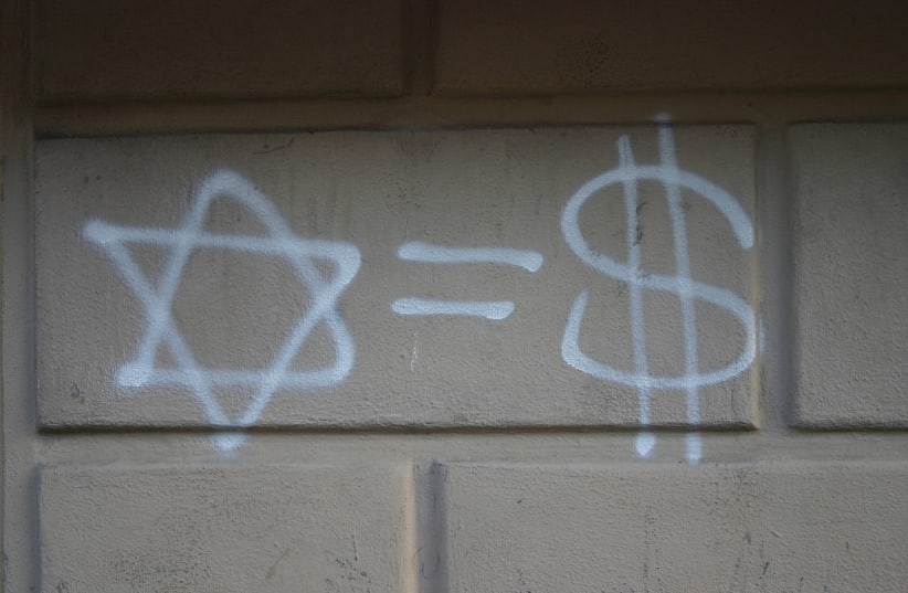  Antisemitic graffiti is seen in Milan, Italy, in 2007. (photo credit: Wikimedia Commons)