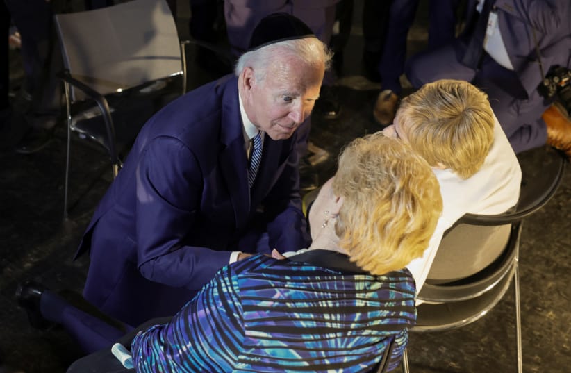  US President Joe Biden meets with holocaust survivors Dr. Gita Cycowicz and Rena Quint during his visit to the Yad Vashem Holocaust Remembrance Center in Jerusalem, July 13, 2022. (photo credit: REUTERS/EVELYN HOCKSTEIN)