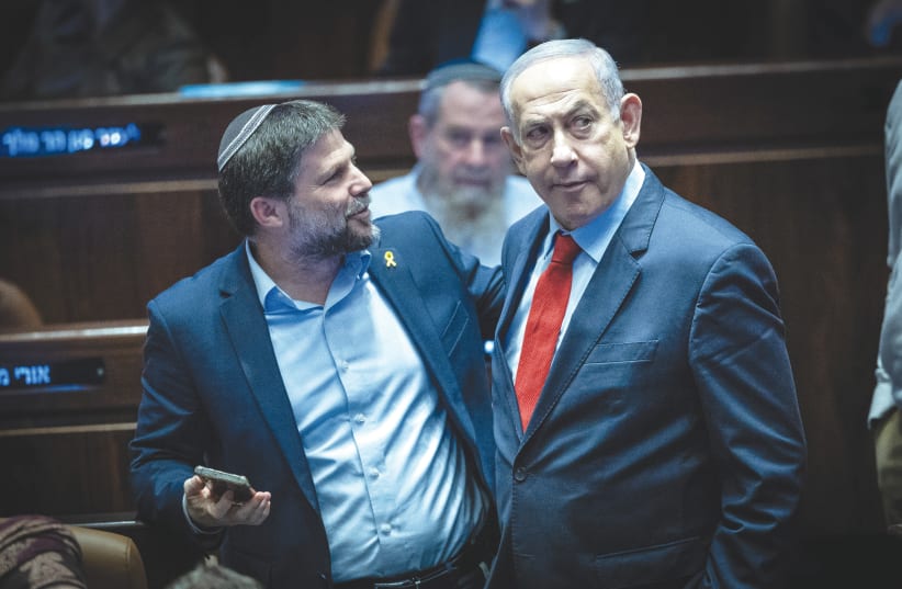  PRIME MINISTER Benjamin Netanyahu and Finance Minister Bezalel Smotrich stand in the Knesset plenum. We would do well to note that ‘from the river to the sea, Palestine shall be free’ has a mirror image in official Israel, says the writer. (photo credit: YONATAN SINDEL/FLASH90)