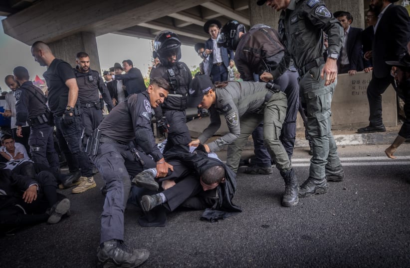  Ultra orthodox Jews block a road and clash with police, May 2, 2024 (photo credit: Chaim Goldberg/Flash90)