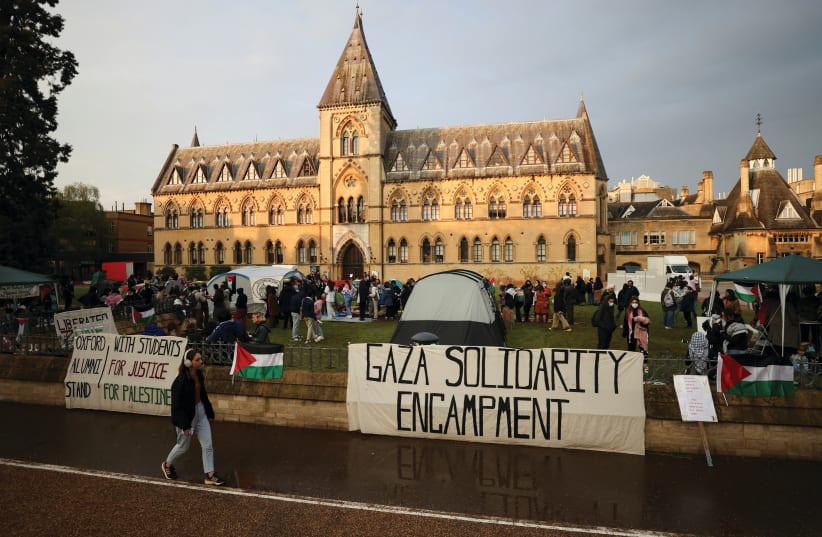  TENTS ARE pitched outside the Oxford University Museum of Natural History, as students occupy parts of British campuses in support of Palestinians in Gaza, this week. Supporters of genocidal jihadist groups are spreading mayhem across the Western world, says the writer.  (photo credit: HOLLIE ADAMS/REUTERS)