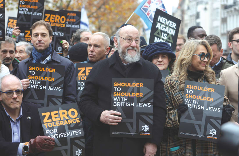  BRITAIN’S CHIEF Rabbi Ephraim Mirvis attends a march in London against the rise of antisemitism in the UK, this past November.  (photo credit: Susannah Ireland/Reuters)