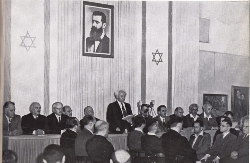  DAVID BEN-GURION officially declares the State of Israel, in Tel Aviv’s Independence Hall, May 14, 1948.  (photo credit: Pinn Hans/GPO)