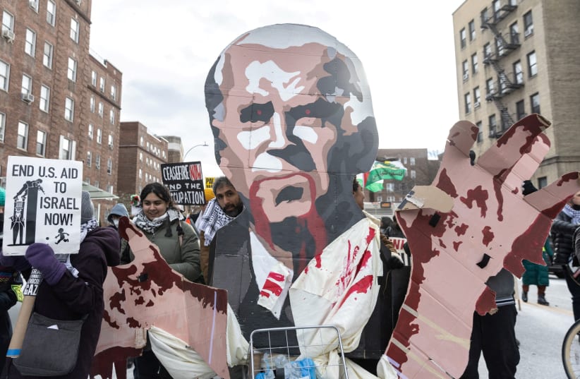  Pro-Palestinian demonstrators protest as they take part in the "Biden: stop supporting genocide!" rally in New York City, US, January 20, 2024. Uploaded on 10/5/2024 (photo credit: JEENAH MOON/REUTERS)