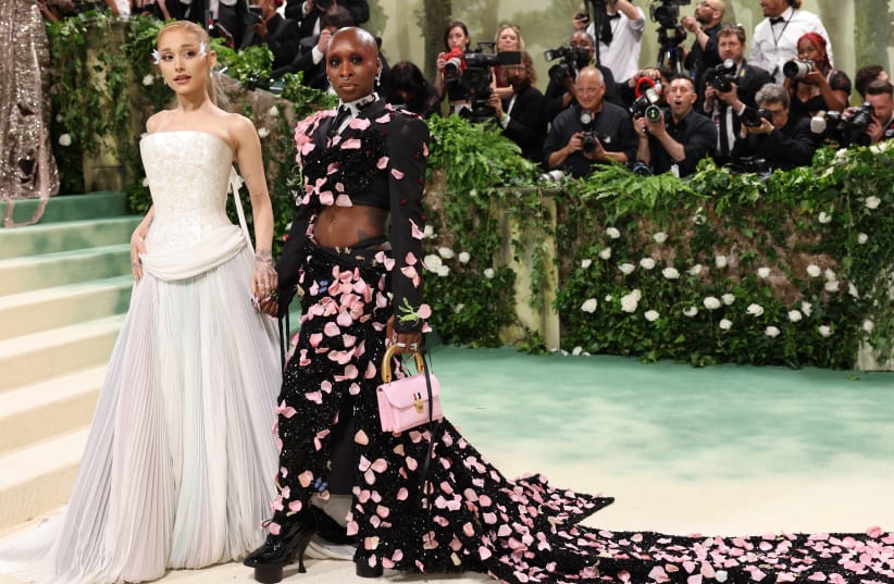  Ariana Grande and Cynthia Erivo pose at the Met Gala, an annual fundraising gala held for the benefit of the Metropolitan Museum of Art's Costume Institute with this year's theme 'Sleeping Beauties: Reawakening Fashion' in New York City, New York, U.S., May 6, 2024. (photo credit: REUTERS/ANDREW KELLY)