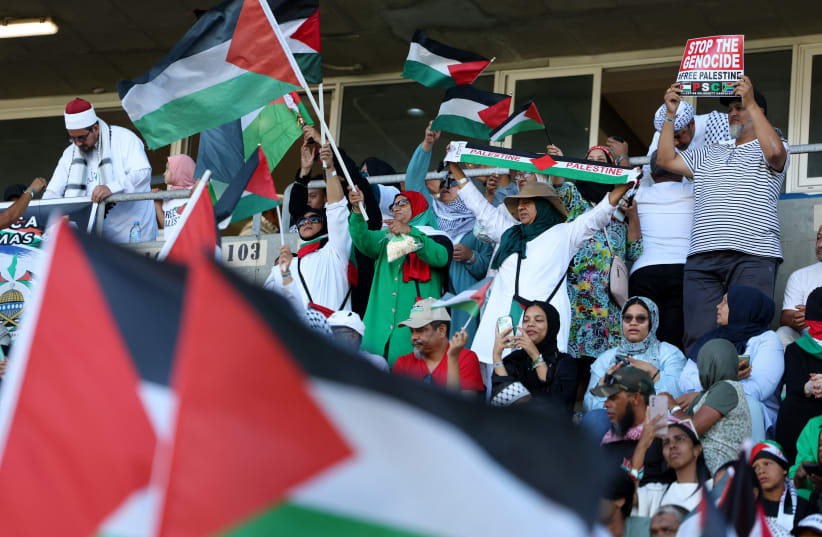  Soccer Football - South Africa Invitation XI v Palestine - Athlone Stadium, Cape Town, South Africa - February 18, 2024 Fans display flags in support of Palestine amid the ongoing conflict between Israel and Hamas. (photo credit: ESA ALEXANDER/REUTERS)