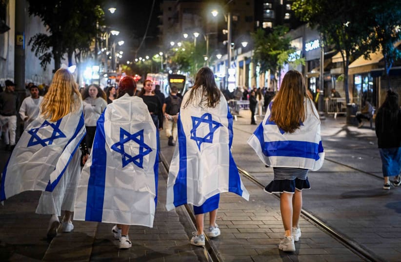  People walk on Jaffa street in Jerusalem, during Israel's 76th Independence Day celebrations, May 13, 2024. (photo credit: ARIE LIEB ABRAMS/FLASH90)