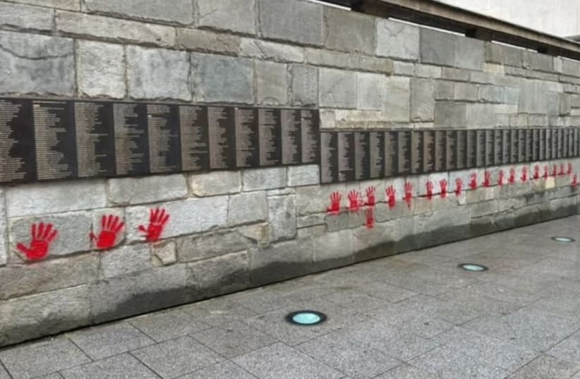Blood-red hands  graffiti on the Paris Holocaust memorial, May 14, 2024. (photo credit: Yonathan Arfi/ Via twitter)