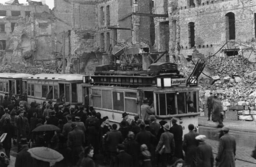  WHAT’S TO stop resolutions from targeting the leveling of Dresden by the Allies during World War II? Pictured: Queuing for one of the few trams spared from bomb damage, 1946. (photo credit: Fred Ramage/Keystone Features/Getty Images)