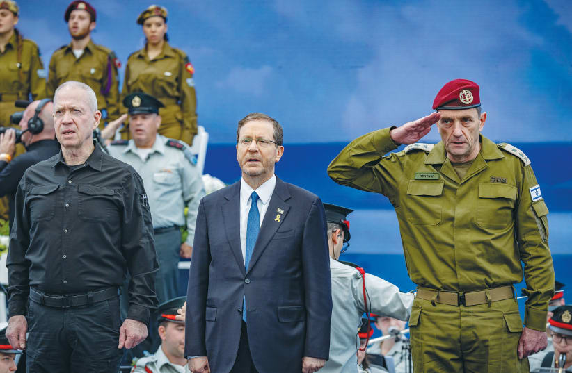  PRESIDENT ISAAC Herzog is flanked by IDF Chief of Staff Herzi Halevi and Defense Minister Yoav Gallant at an event for outstanding soldiers at the President’s Residence in Jerusalem on Independence Day. (photo credit: YONATAN SINDEL/FLASH90)