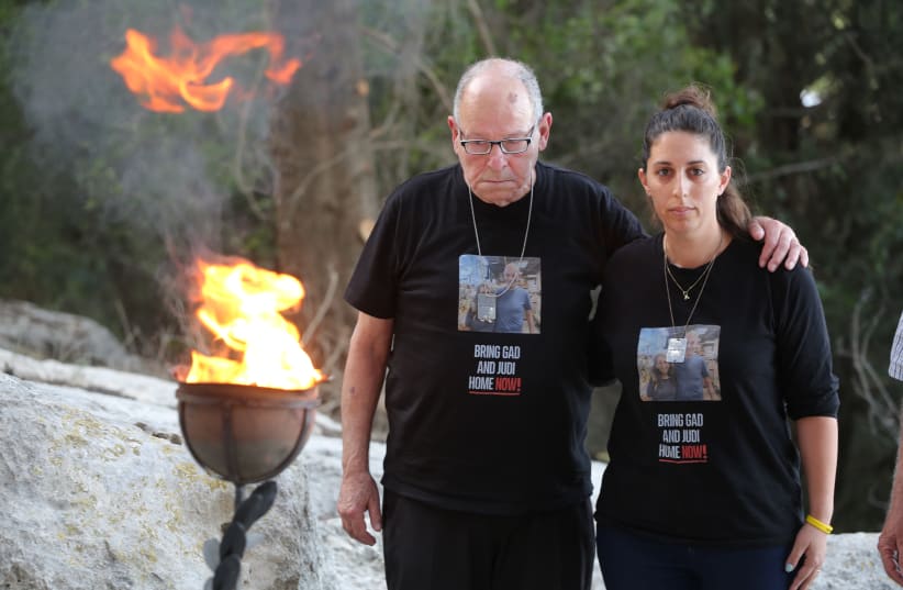  HOSHEA HAGGI and daughter Dalia light the torch at the AACI ceremony. Hoshea’s brother Gadi and sister-in-law Judi were killed on Oct. 7, with their bodies kidnapped to Gaza (photo credit: NOAM SHARON)