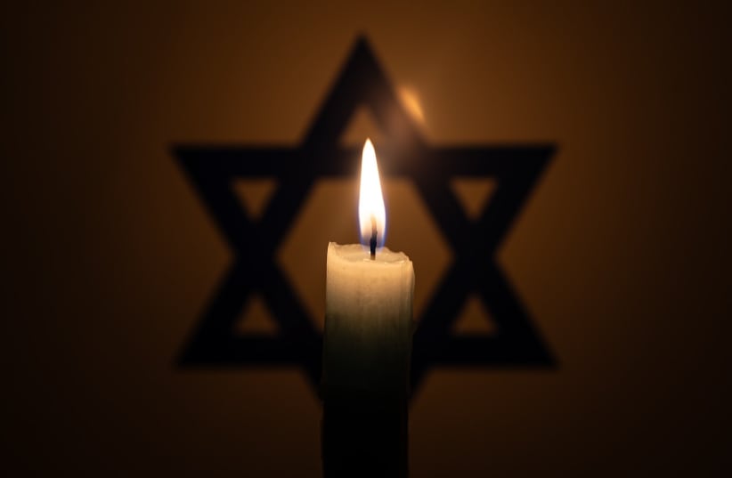  Star of David and yizkor candle.  (photo credit: GETTY IMAGES)