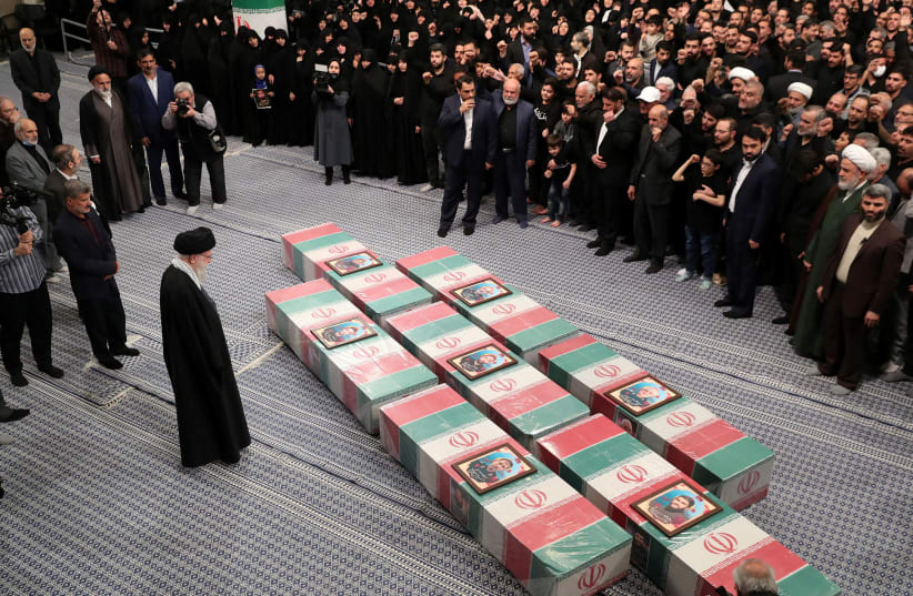  Iran's Supreme Leader, Ayatollah Ali Khamenei looks at the coffins of members of the Islamic Revolutionary Guard Corps who were killed in the Israeli airstrike on the Iranian embassy complex in the Syrian capital Damascus, during a funeral ceremony in Tehran, Iran April 4, 2024.  (photo credit:  Office of the Iranian Supreme Leader/WANA (West Asia News Agency)/Handout via REUTERS)