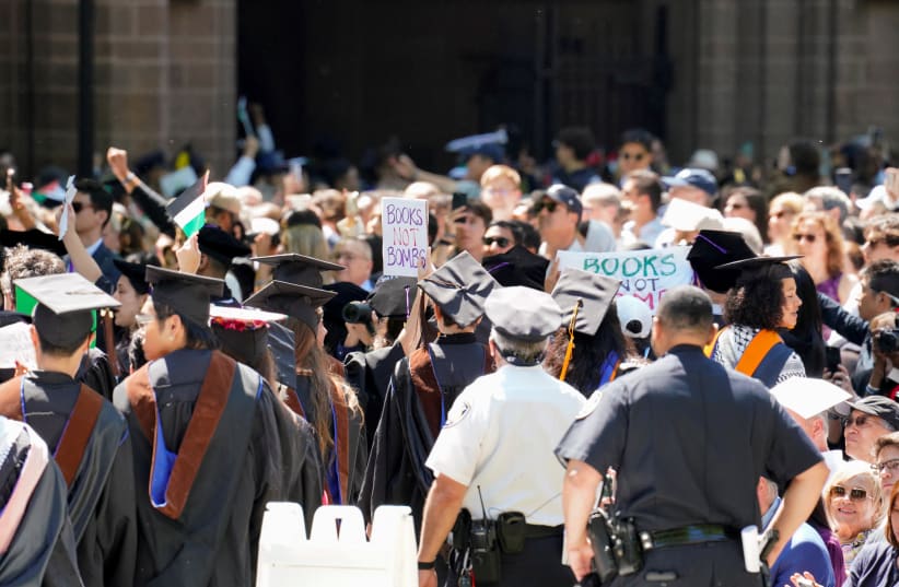 Graduates protest the conflict between Israel and the Palestinian Islamist group Hamas, during the commencement at Yale University, New Haven, Connecticut, U.S., May 20, 2024. (photo credit: REUTERS/MICHELLE MCLOUGHLIN)