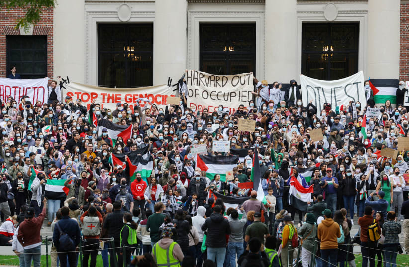  Demonstrators take part in an "Emergency Rally: Stand with Palestinians Under Siege in Gaza," amid the ongoing conflict between Israel and the Palestinian Islamist group Hamas, at Harvard University in Cambridge, Massachusetts, U.S., October 14, 2023.  (photo credit: BRIAN SNYDER/REUTERS)