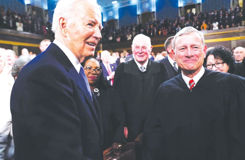  US PRESIDENT Joe Biden greets Supreme Court Chief Justice John Roberts before the president’s State of the Union address, in March. (photo credit: Shawn Thew/Reuters)