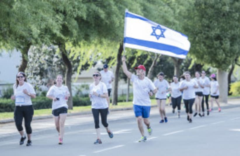  POR OCTAVO AÑO consecutivo, la "Carrera del Recuerdo" se celebrará en comunidades judías de todo el mundo el Día del Recuerdo. 7/5/2024 (photo credit: Courtesy)