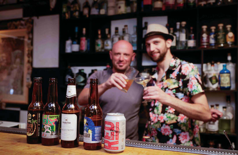  LEON SHVARTZ (L) and Guy Krieger, partners in The Rabbit Hole cocktail bar in Jerusalem, enjoy some cocktails made with beer. (photo credit: MARC ISRAEL SELLEM)