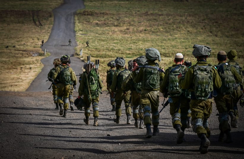 Israeli soldiers from the Golani brigade take part in a military drill in the Golan Heights, northern Israel, May 22, 2024 (photo credit: MICHAEL GILADI/FLASH90)