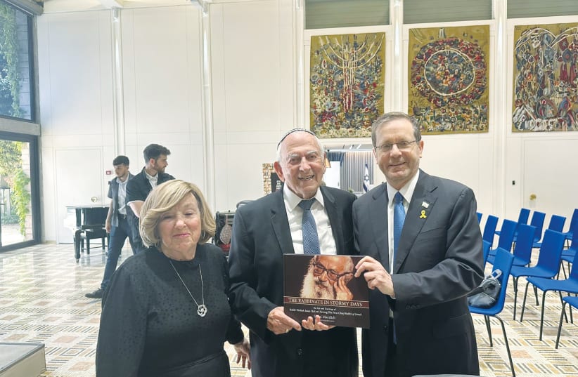  PRESIDENT ISAAC HERZOG with Rabbi Samuel Fox and his wife, Miriam.  (photo credit: Courtesy President’s Office)