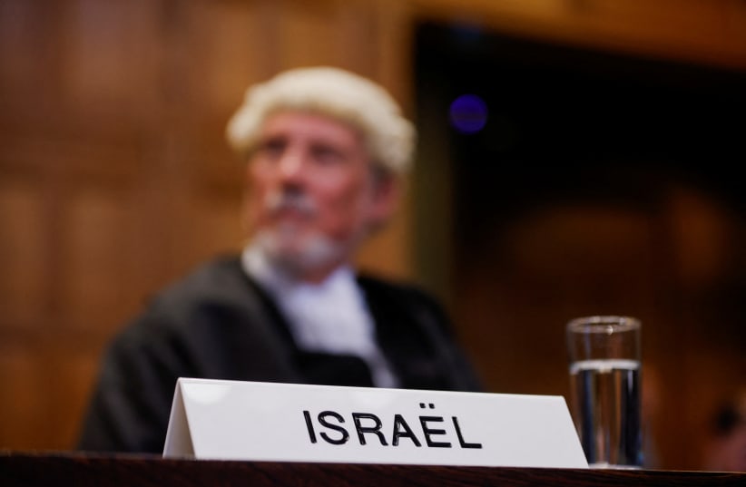 British jurist Malcolm Shaw looks on at the International Court of Justice (ICJ), during a ruling on South Africa's request to order a halt to Israel's Rafah offensive in Gaza as part of a larger case brought before the Hague-based court by South Africa accusing Israel of genocide, in The Hague, Net (photo credit: JOHANNA GERON/REUTERS)