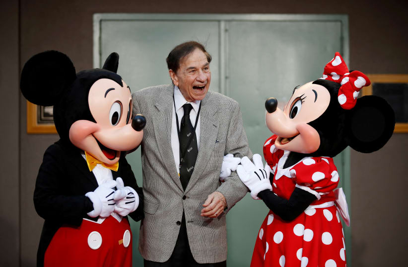  Mickey and Minnie Mouse and Richard M. Sherman pose during a dedication of Stage A on The Walt Disney Studios Lot to the Sherman Brothers, songwriters Richard M. Sherman and Robert B. Sherman, before the World Premiere of Disney's "Christopher Robin," in Burbank, California, July 30, 2018. (photo credit: REUTERS/DANNY MOLOSHOK/FILE PHOTO)