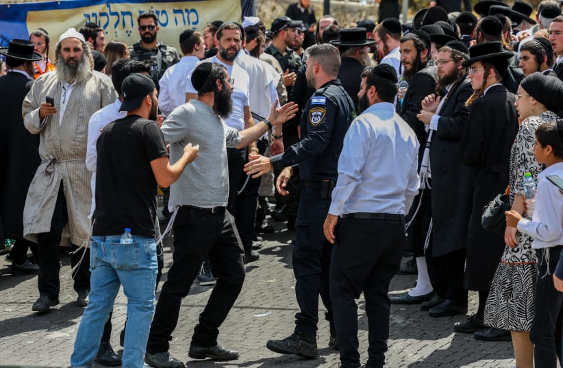Police push back Jews who tried to enter the Tomb of Rabbi Shimon bar Yochai on the Jewish holiday of Lag Ba'Omer, in Meron. May 26, 2024.  (photo credit: David Cohen/Flash90)