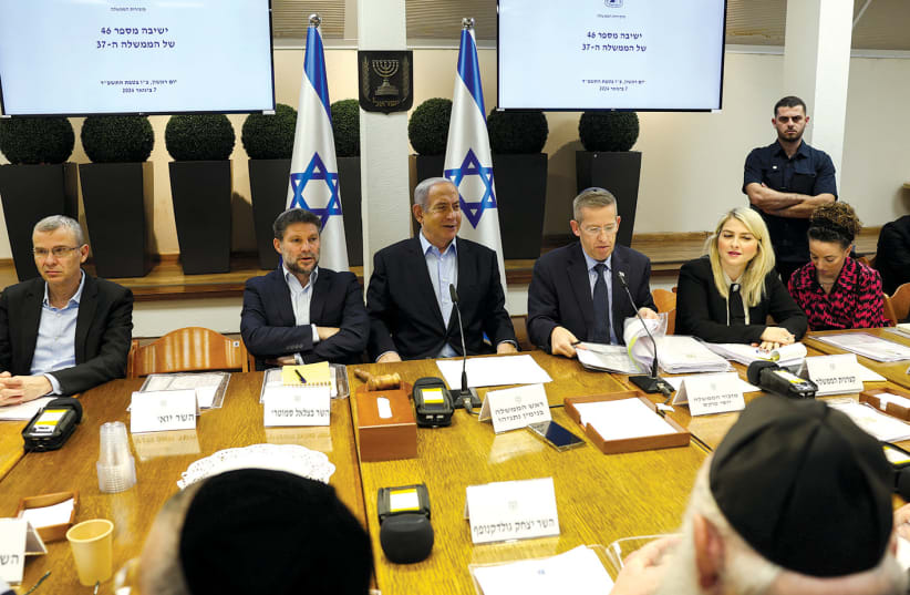  Prime Minister Benjamin Netanyahu addresses a cabinet meeting in Tel Aviv on January 7.  (photo credit: RONEN ZVULUN/REUTERS)